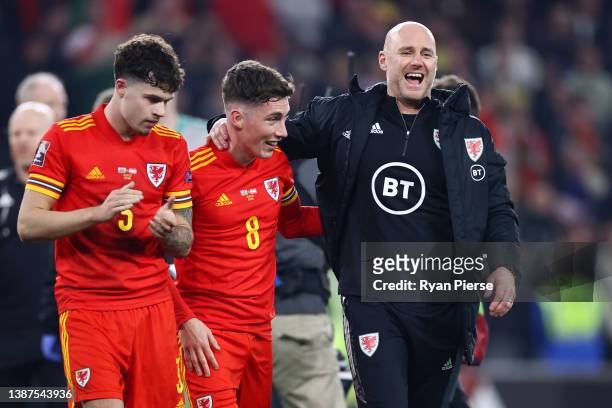 Neco Williams, Harry Wilson of Wales and Rob Page, Head Coach of Wales celebrate following their side's victory in the 2022 FIFA World Cup Qualifier...