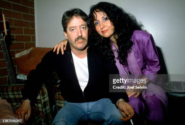 American blues harmonica player, singer and band leader, Paul Butterfield and American folk and blues singer, Maria Muldaur, pose for a portrait...