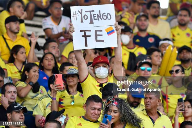 Fan of Colombia holds a sign that reads 'I have faith' prior to a match between Colombia and Bolivia as part of FIFA World Cup Qatar 2022 Qualifier...