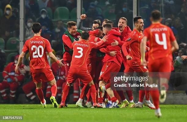 Aleksandar Trajkovski of North Macedonia celebrates after scoring their side's first goal with team mates during the 2022 FIFA World Cup Qualifier...