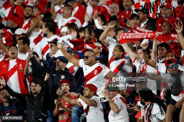 Fans of Peru cheer for their team before a match between Uruguay and Peru as part of FIFA World Cup Qatar 2022 Qualifiers at Centenario Stadium on...