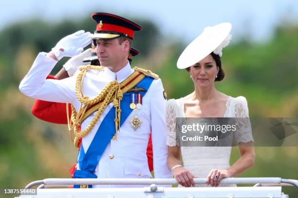 Catherine, Duchess of Cambridge and Prince William, Duke of Cambridge ride in a Land Rover as they attend the inaugural Commissioning Parade for...