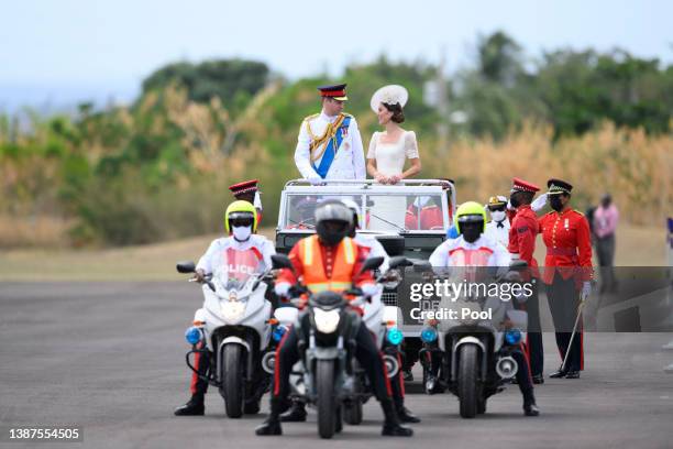 Catherine, Duchess of Cambridge and Prince William, Duke of Cambridge ride in a Land Rover as they attend the inaugural Commissioning Parade for...