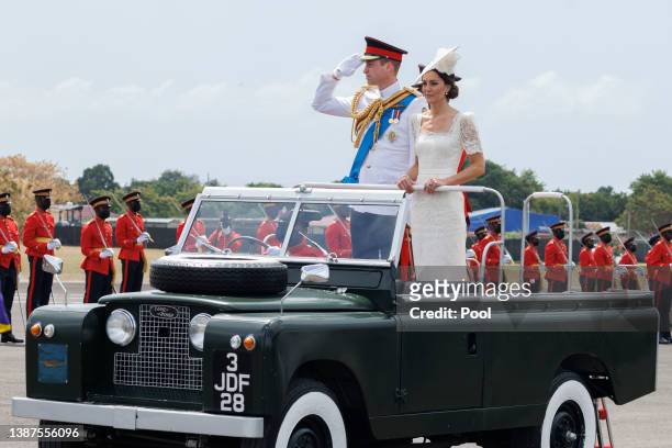 Catherine, Duchess of Cambridge and Prince William, Duke of Cambridge ride in a Land Rover as they attend the inaugural Commissioning Parade for...