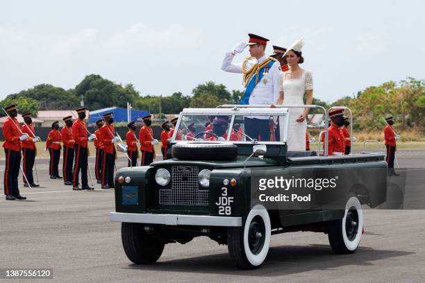 Catherine, Duchess of Cambridge and Prince William, Duke of Cambridge ride in a Land Rover as they attend the inaugural Commissioning Parade for...