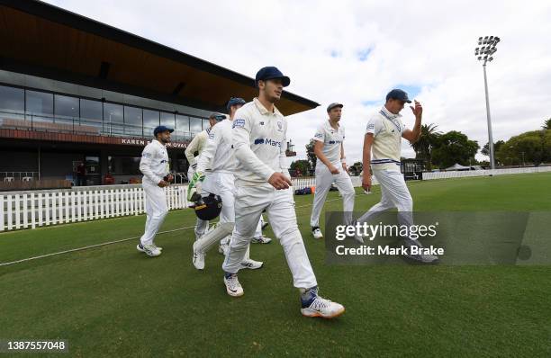 Blues head out to field during day three of the Sheffield Shield match between South Australia and New South Wales at Karen Rolton Oval, on March 25...