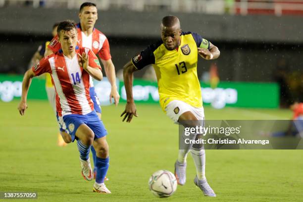 Andrés Cubas of Paraguay competes for the ball with Enner Valencia of Ecuador during a match between Paraguay and Ecuador as part of South American...