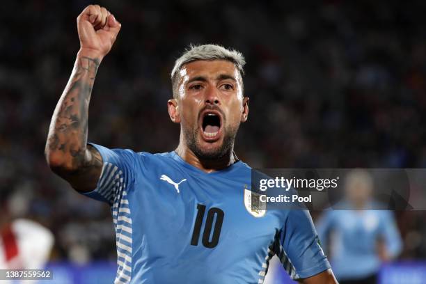 Giorgian De Arrascaeta of Uruguay celebrates after scoring the opening goal during a match between Uruguay and Peru as part of FIFA World Cup Qatar...