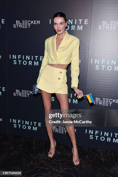 Alina Baikova holds the Ukrainian flag at the "Infinite Storm" screening at Regal Union Square on March 24, 2022 in New York City.