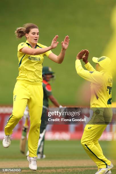 Annabel Sutherland of Australia takes the wicket of Fargana Hoque Pinky of Bangladesh during the 2022 ICC Women's Cricket World Cup match between...