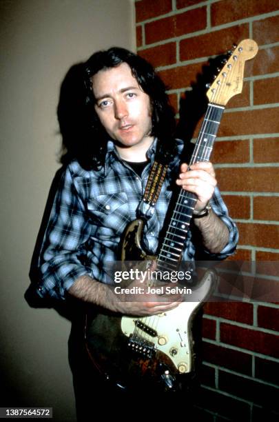 Irish blues and rock guitarist, singer, songwriter, and producer, Rory Gallagher , poses for a portrait with his guitar on September 25, 1982 at the...