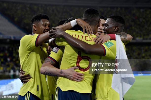 Matheus Uribe of Colombia celebrates with teammates after scoring the third goal of his team during a match between Colombia and Bolivia as part of...