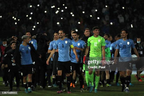 Diego Godín of Uruguay and teammates celebrate qualifying after winning a match between Uruguay and Peru as part of FIFA World Cup Qatar 2022...