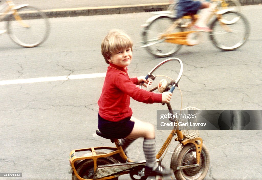 Young boy riding bicycle