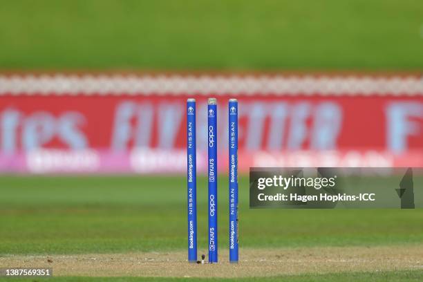 The wickets are seen without bails due to strong winds during the 2022 ICC Women's Cricket World Cup match between Bangladesh and Australia at Basin...