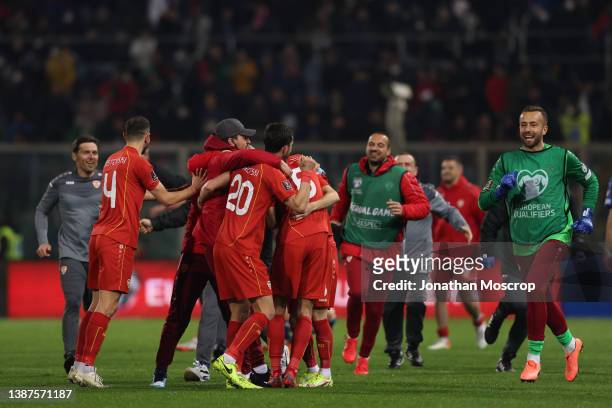 North Macedonia players celebrate following the final whistle of the 2022 FIFA World Cup Qualifier knockout round play-off match between Italy and...