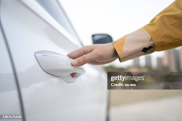 open white car door - fahrzeugtür stock-fotos und bilder