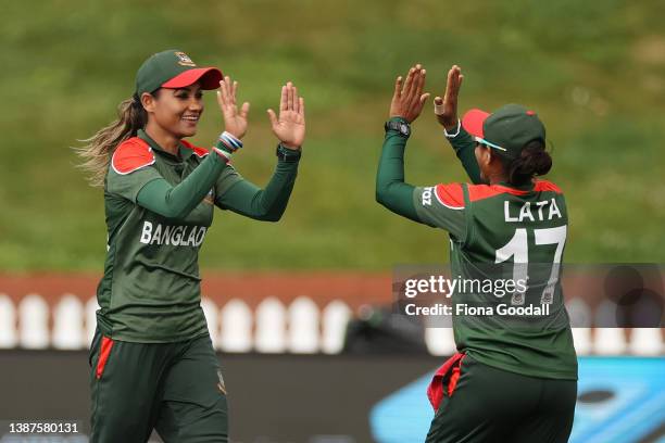 Jahanara Alam of Bangladesh celebrates her catch to dismiss Alyssa Healy of Australia during the 2022 ICC Women's Cricket World Cup match between...