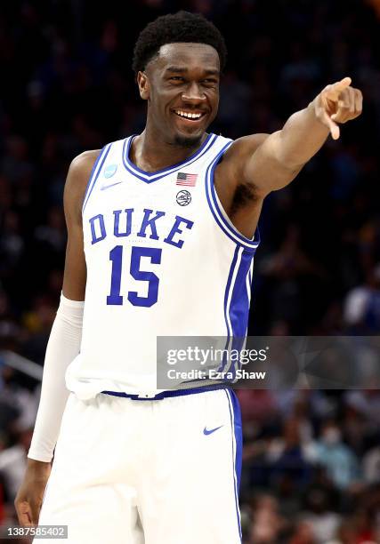 Mark Williams of the Duke Blue Devils celebrates after defeating the Texas Tech Red Raiders with a final score of 73-78 in the Sweet Sixteen round...