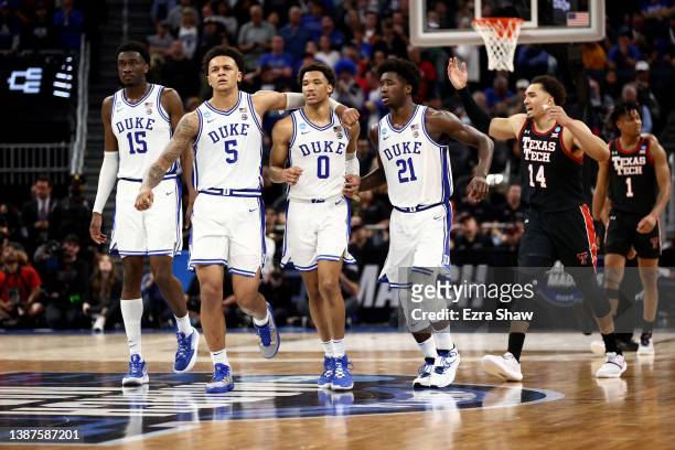Mark Williams, Paolo Banchero, Wendell Moore Jr. #0, and AJ Griffin of the Duke Blue Devils move across the court during the second half against the...