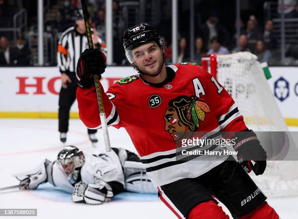 Alex DeBrincat of the Chicago Blackhawks celebrates his goal past Jonathan Quick of the Los Angeles Kings, to clinch a 4-3 win in an overtime...