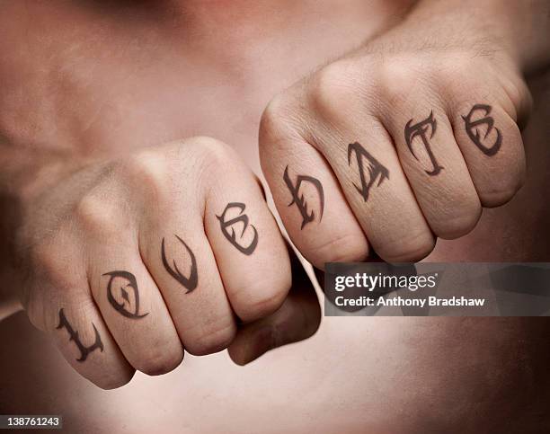 love, hate fist tattoos - love hate stock-fotos und bilder