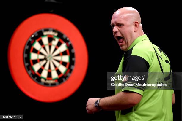 Michael 'Mighty Mike' van Gerwen of Netherlands celebrates as he competes against Joe 'The Rockstar' Cullen of England during Night 7 of Cazoo...