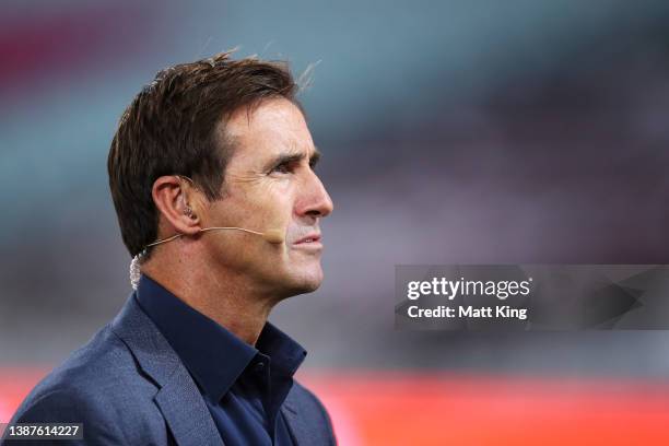 Andrew Johns is seen as he prepares for the pre-match commentary before the round three NRL match between the South Sydney Rabbitohs and the Sydney...