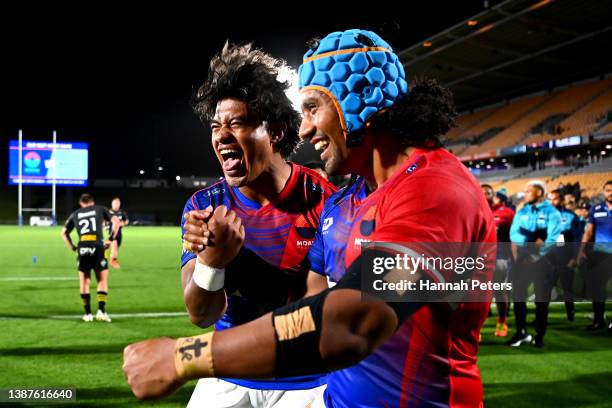 Danny Toala and Neria Foma’i of Moana Pasifika celebrate after scoring the winning try to win the round six Super Rugby Pacific match between the...