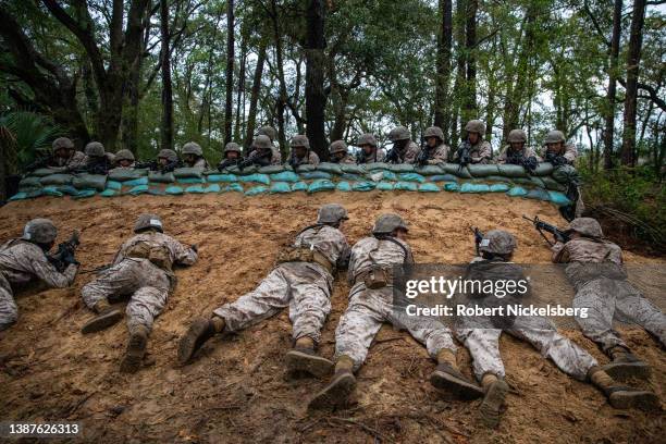 Marine Corps recruits face off during a mock attack situation as they take part in the Crucible training exercise on March 24, 2022 in Parris Island,...