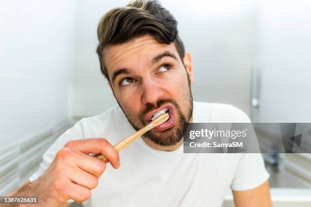 teeth brushing routine - people brushing their teeth stock pictures, royalty-free photos & images