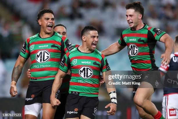 Cody Walker of the Rabbitohs celebrates with Latrell Mitchell, Keaon Koloamatangi and Lachlan Ilias of the Rabbitohs after scoring a try during the...