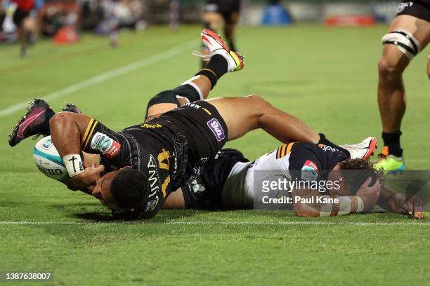 Toni Pulu of the Force scores a try against Tom Banks of the Brumbies during the round six Super Rugby Pacific match between the Western Force and...
