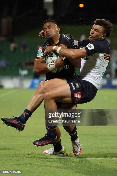 Toni Pulu of the Force gets tackled by Tom Banks of the Brumbies while running in for try during the round six Super Rugby Pacific match between the...