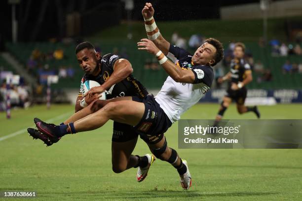 Toni Pulu of the Force collides with Tom Banks of the Brumbies while running in for try during the round six Super Rugby Pacific match between the...