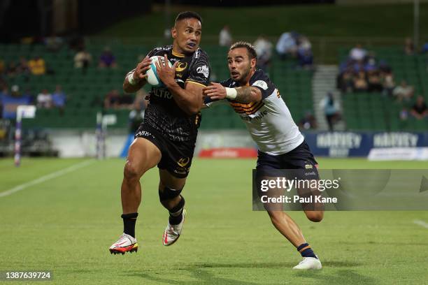 Toni Pulu of the Force runs the ball against Andy Muirhead of the Brumbies during the round six Super Rugby Pacific match between the Western Force...