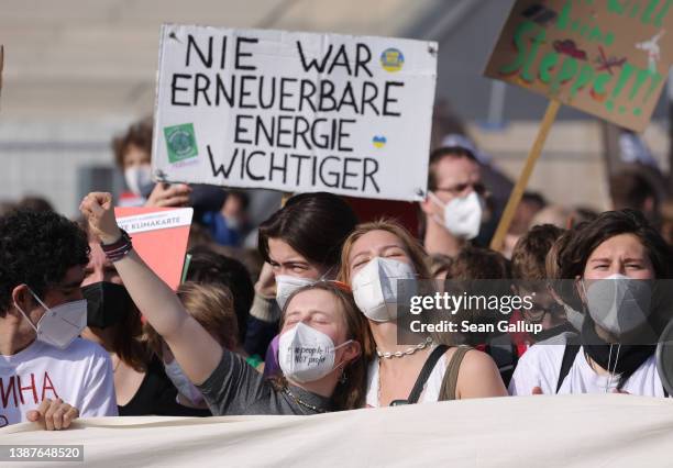 Supporters of the Fridays for Future climate action movement march as part of a global climate strike on March 25, 2022 in Berlin, Germany. The...