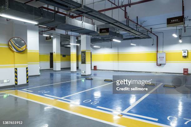 empty underground parking lot - fire sprinkler stock pictures, royalty-free photos & images