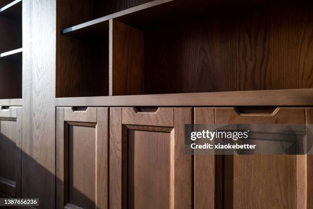 bookcase with sun rays effect - cubbyhole stock pictures, royalty-free photos & images