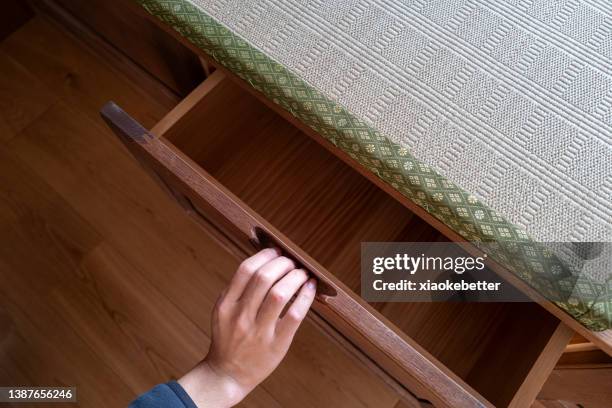 man's hand looking down to open drawer - 引き出し ストックフォトと画像