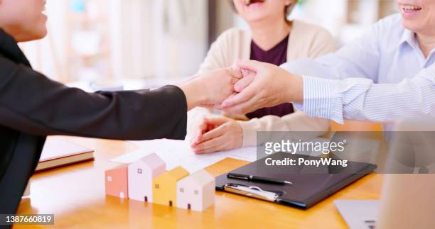 asian elderly couple buy house - money advice stock pictures, royalty-free photos & images