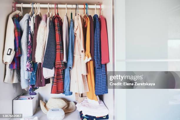 girl clothes inside the wardrobe - wardrobe stock pictures, royalty-free photos & images