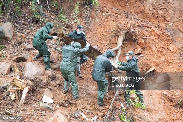 Rescuers work at the site of a plane crash on March 23, 2022 in Tengxian County, Wuzhou City, Guangxi Zhuang Autonomous Region of China. A China...