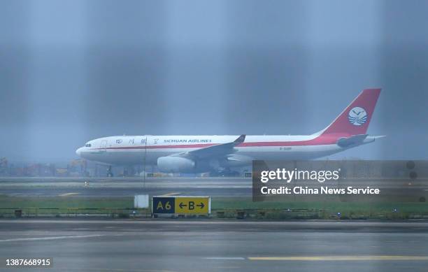 An Airbus A330 cargo plane of Sichuan Airlines, which departed from Chongqing to Moscow, lands at Chongqing Jiangbei International Airport after a...