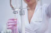 Healthcare professional preparing for conducting intravenous vitamin drip