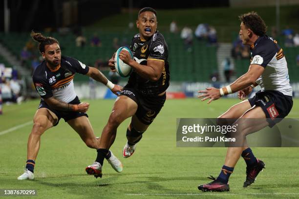 Toni Pulu of the Force runs in for a try against Andy Muirhead and Tom Banks of the Brumbies during the round six Super Rugby Pacific match between...