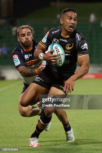 Toni Pulu of the Force breaks a tackle by Andy Muirhead of the Brumbies during the round six Super Rugby Pacific match between the Western Force and...