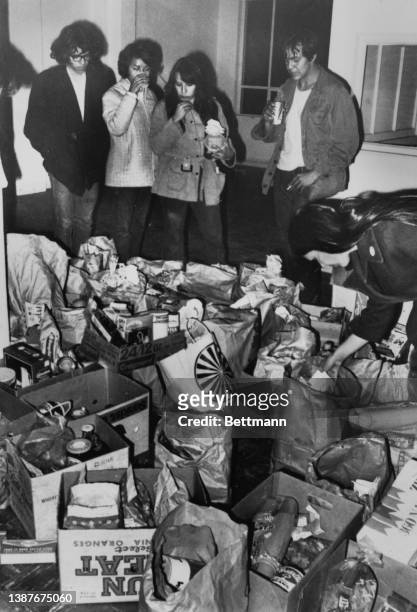 Some of the Native Americans who occupied Alcatraz Island examine food supplies brought to the former federal prison site after the government lifted...