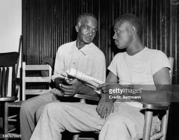 American state witness Willie Reed , who saw Emmett Till after he was taken from his home, sits with a man during the trial of those accused of the...