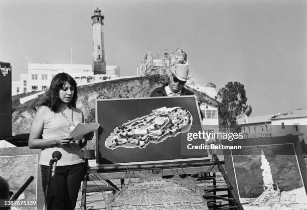 Native American activist LaNada Means addresses a press conference alongside an artist's impression of a proposed cultural center on the first...